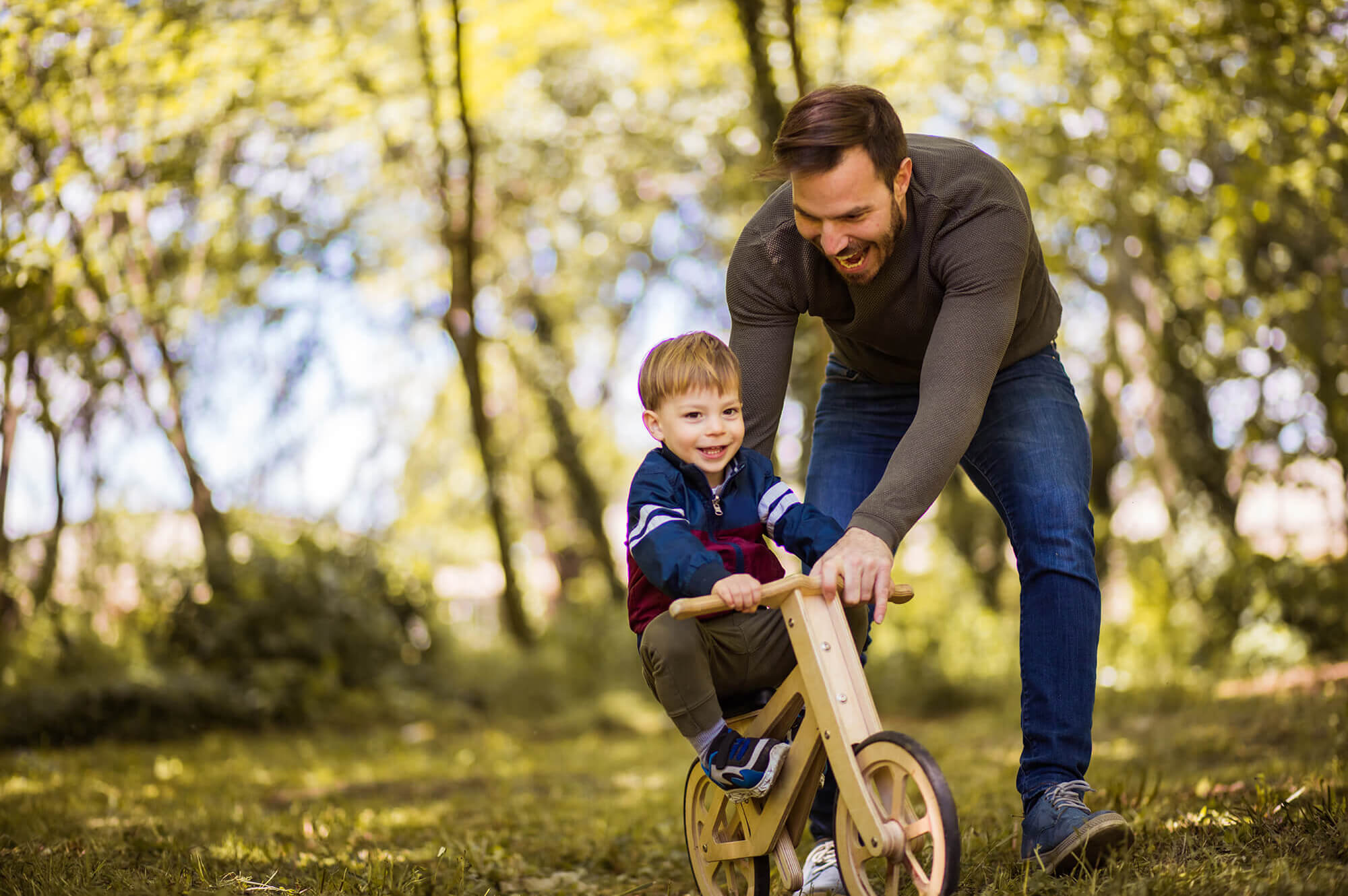 Little boy learning to bike